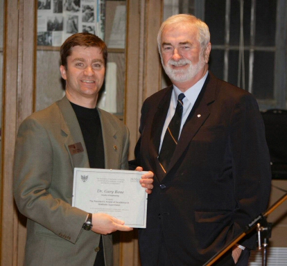 Picture of Dr. Bone receiving the award